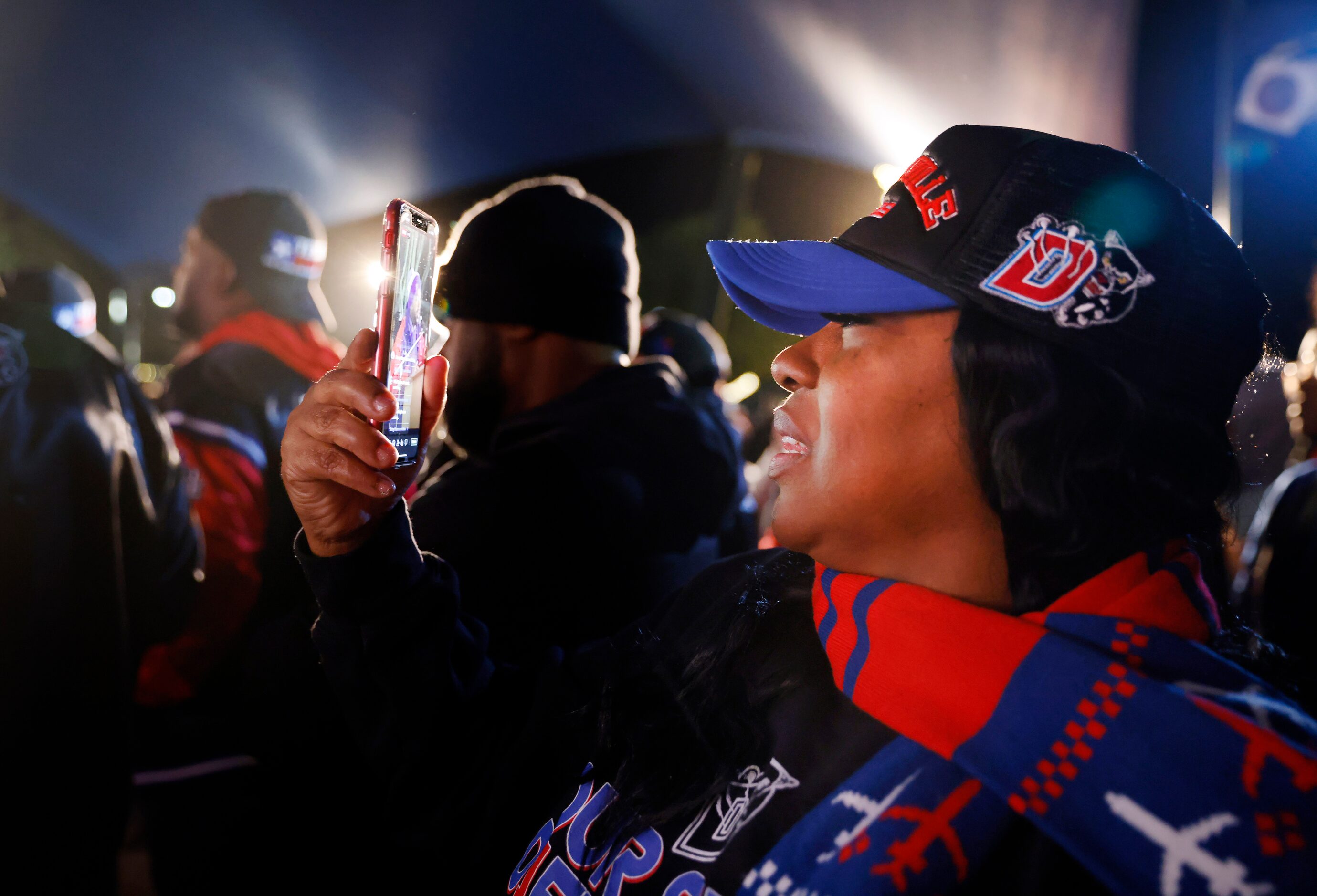 Rochelle Davis, mother of a Duncanville cheerleader, records speakers gathered in Armstrong...