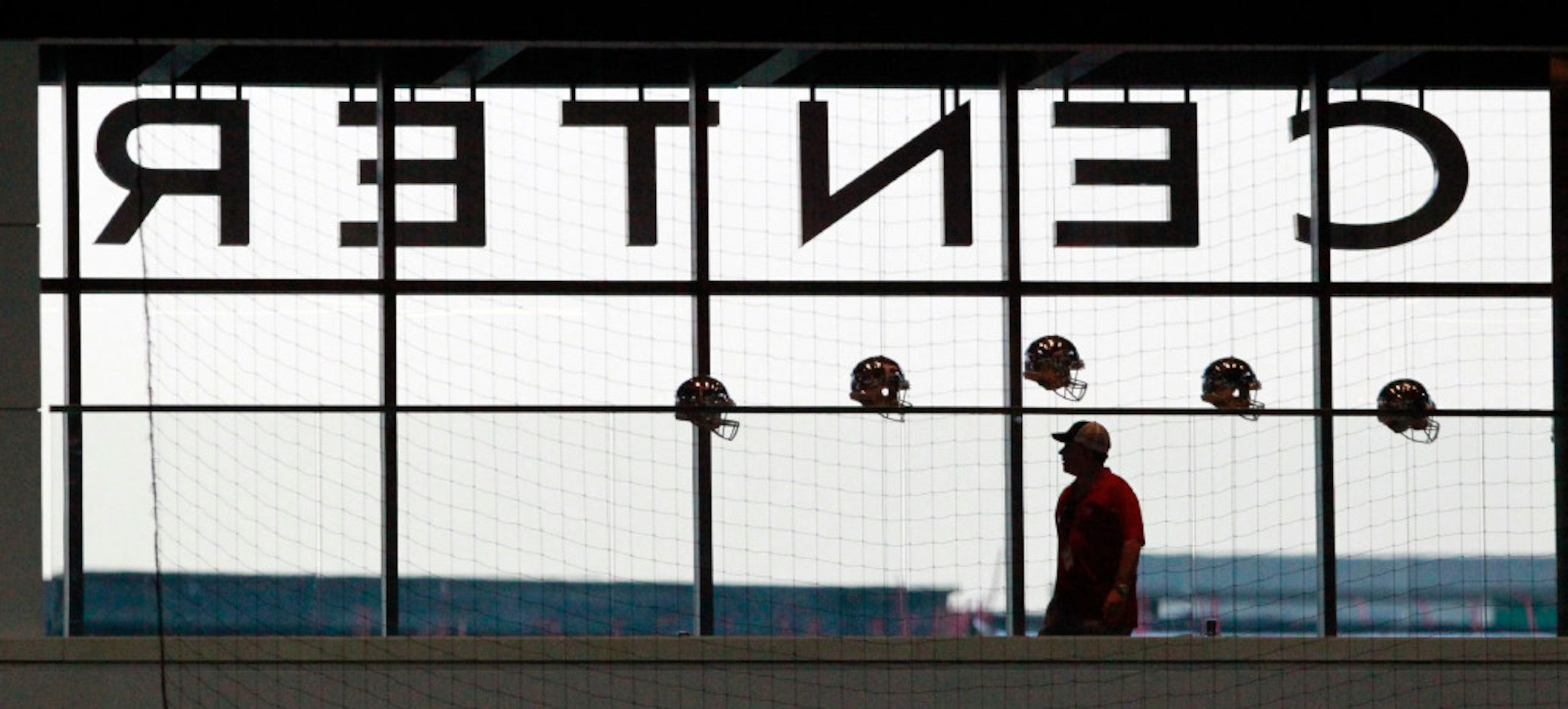 A fan walks the concourse of the Ford Center at The Star before the start of a high school...