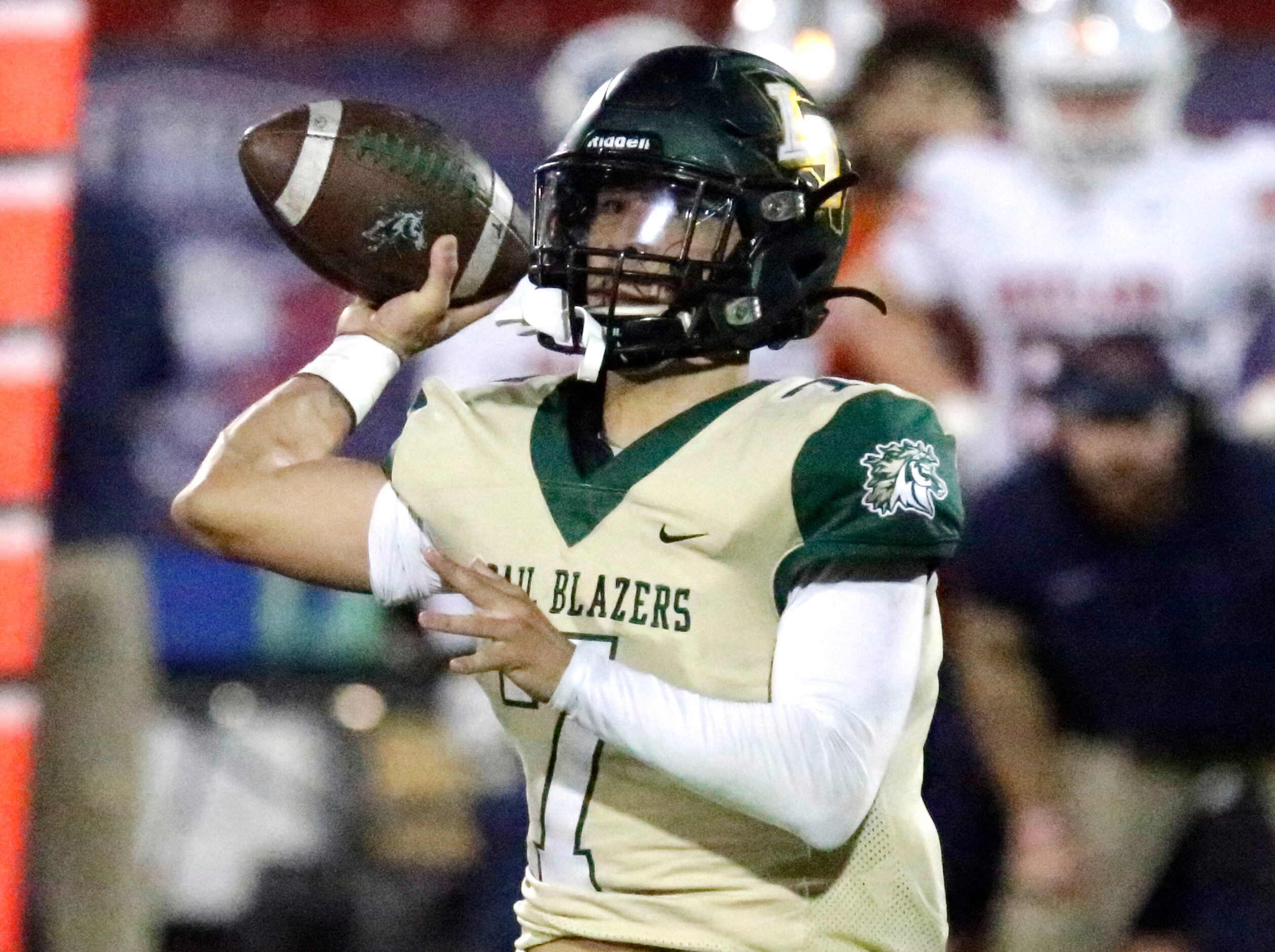 Lebanon Trail High School quarterback Zach Hare (7) throws a pass during the first half as...