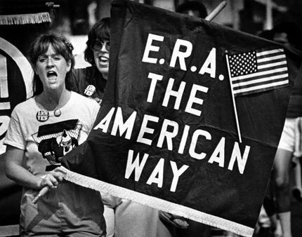 A supporter of the Equal Rights Amendment chants slogans with about 150 marchers who...