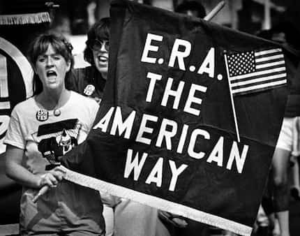 A supporter of the Equal Rights Amendment chants slogans with about 150 marchers who...