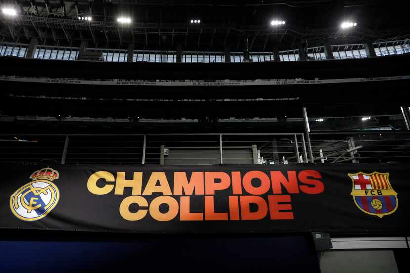 Ahead of the Soccer Champions Tour futbol game a banner shows FC Barcelona and Real Madrid...