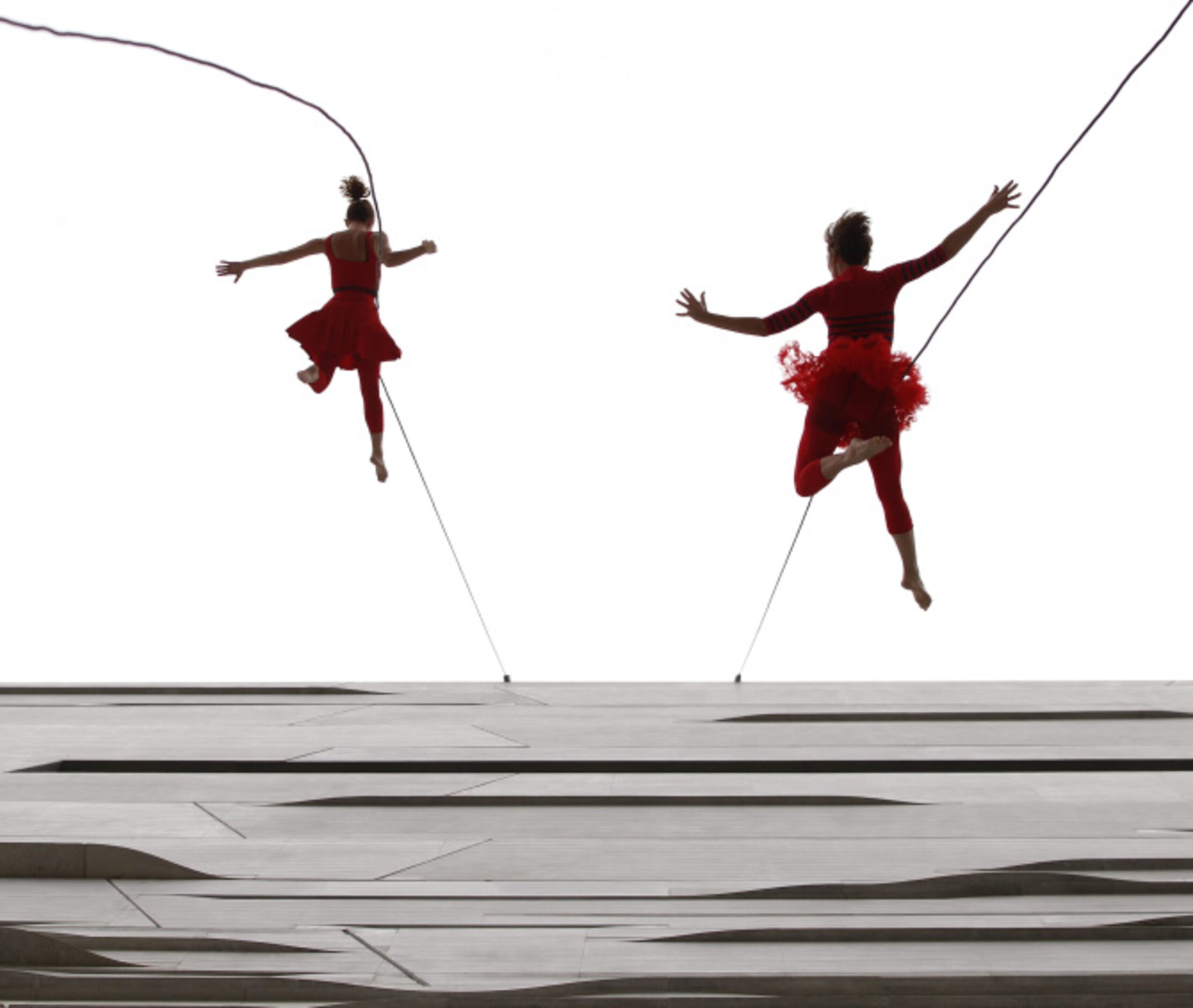 Anje Lockhart (left) and Rachael Lincoln of Bandaloop perform during the opening of the...