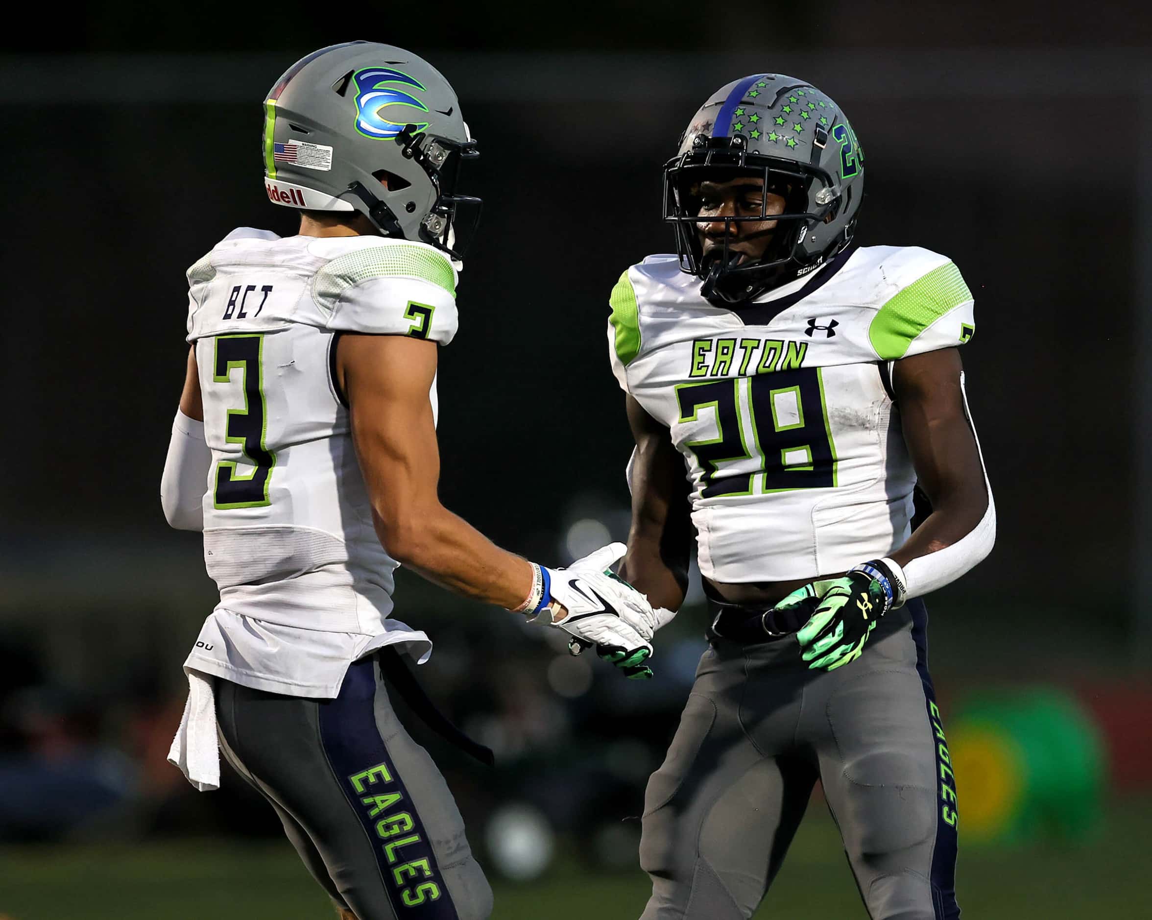 Eaton running back Demarion Williams (28) celebrates with wide receiver Talan Holmes (3)...