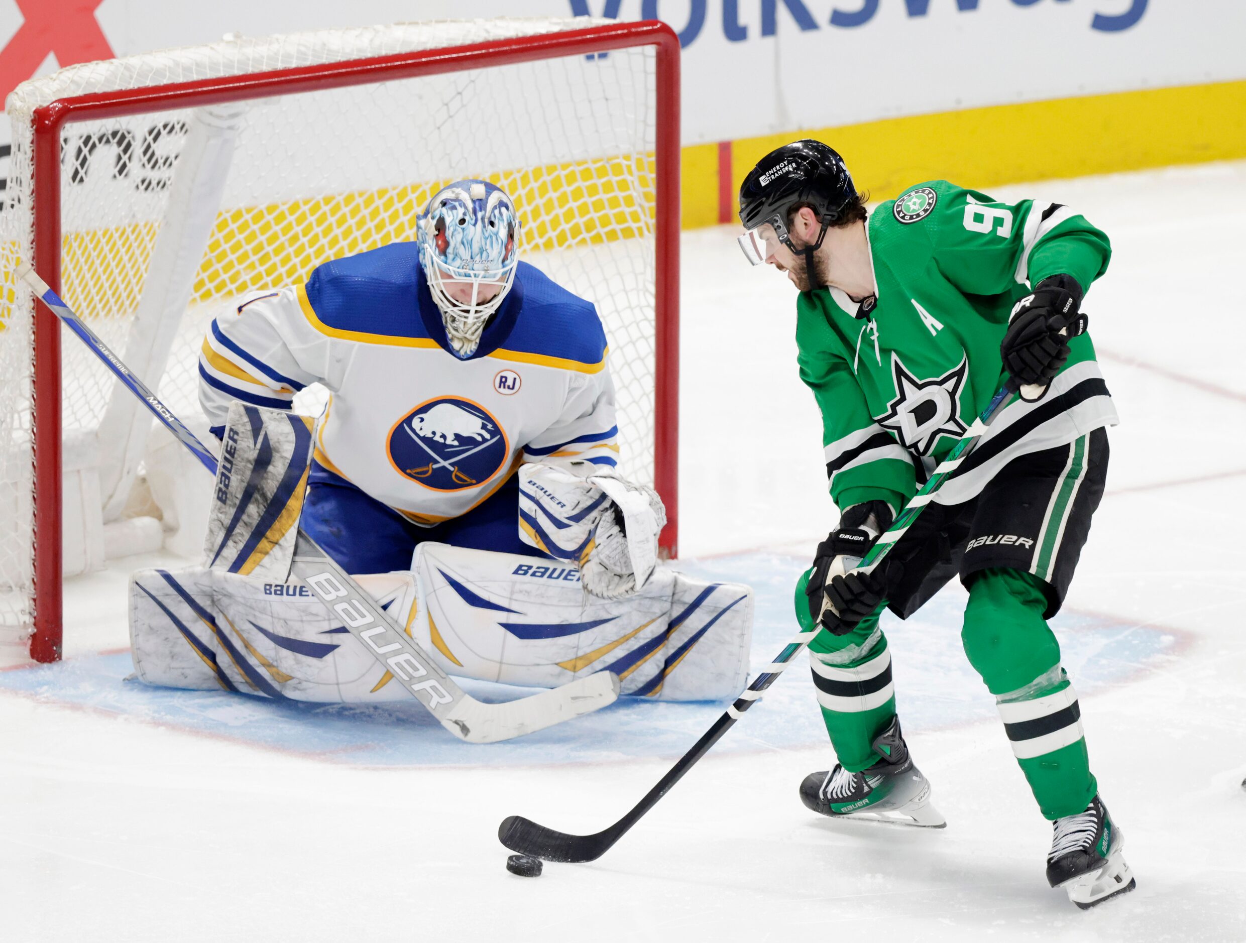 Dallas Stars center Tyler Seguin (91) attempts to shoot on Buffalo Sabres goaltender...