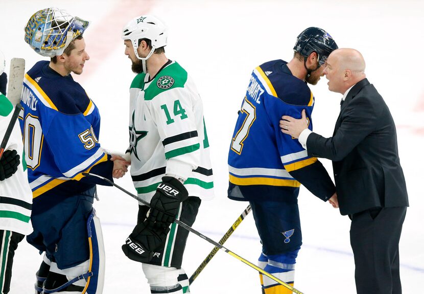 Dallas Stars left wing Jamie Benn (14) shakes hands with St. Louis Blues goaltender Jordan...