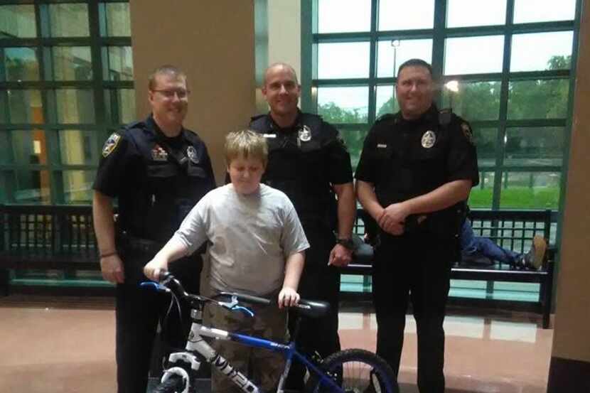  Irving police Officers Craig Holman (left), Kyle Chaisson and Rawley Miller with Jonathan...