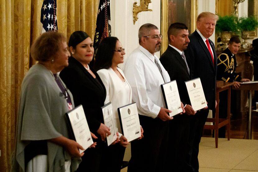 President Donald Trump stood with five civilians receiving Heroic Commendations for actions...