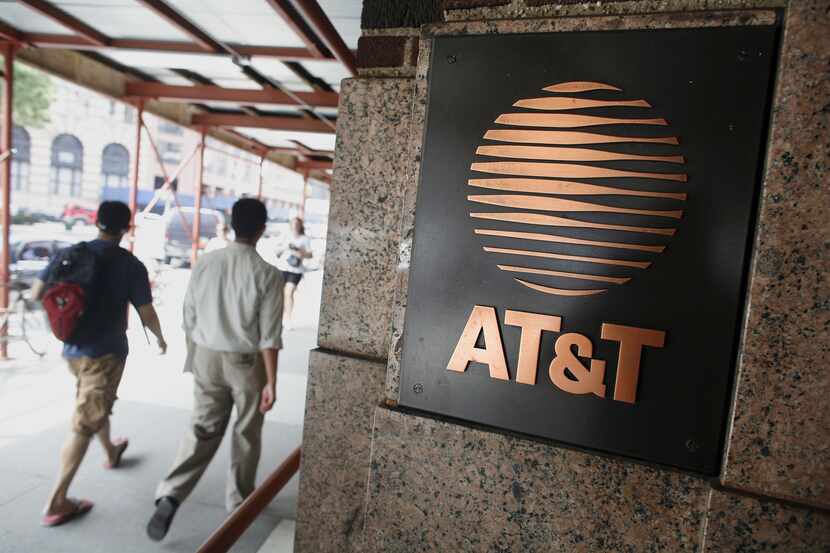 NEW YORK - FILE:  Two men walk past the AT&T building July 25, 2006 in New York City....