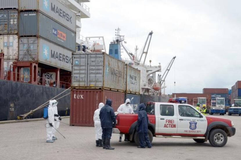 
Health workers conducted an Ebola prevention drill at the port in Monrovia, Liberia, on...