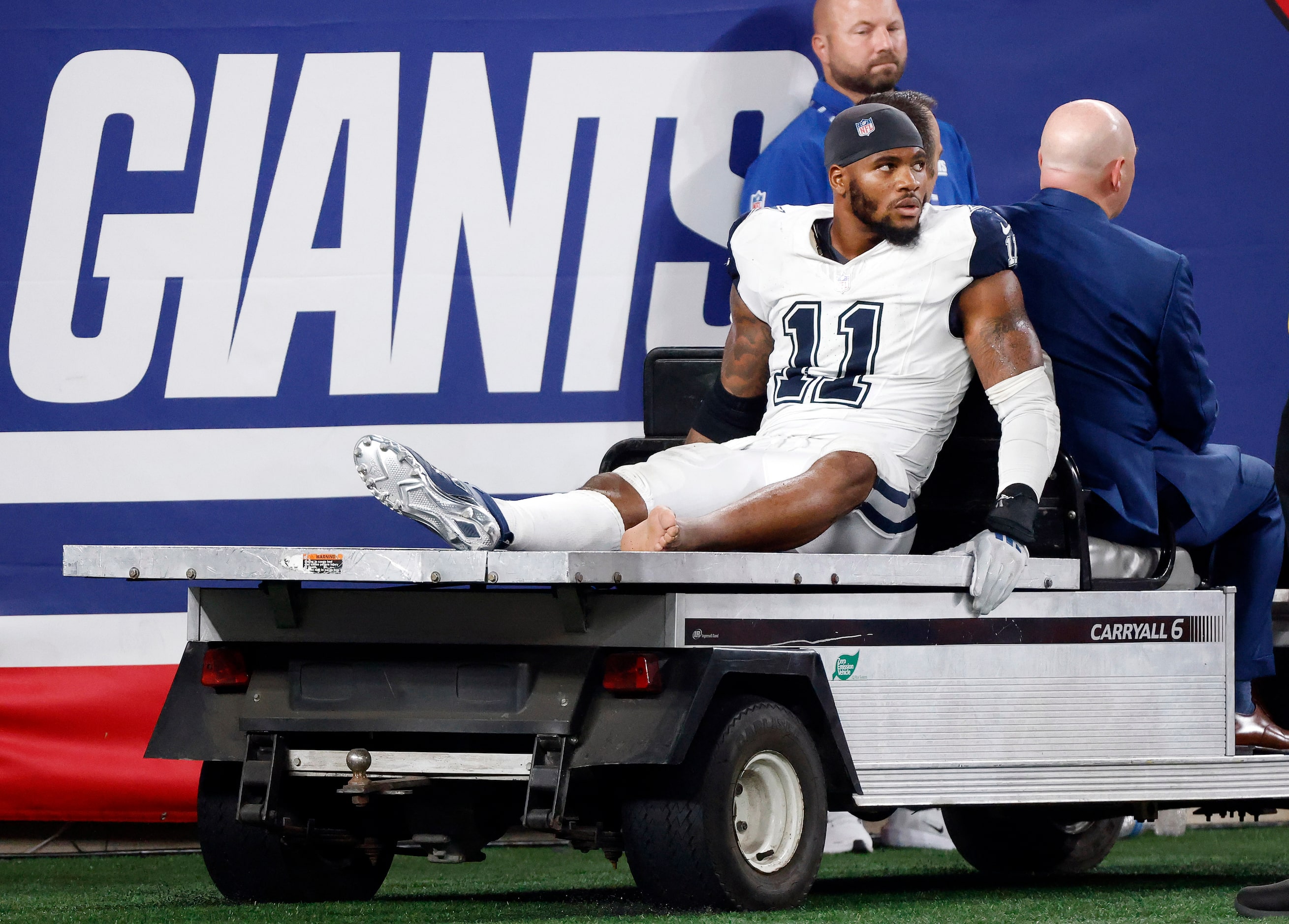 Dallas Cowboys linebacker Micah Parsons (11) is carted off the field following a fourth...