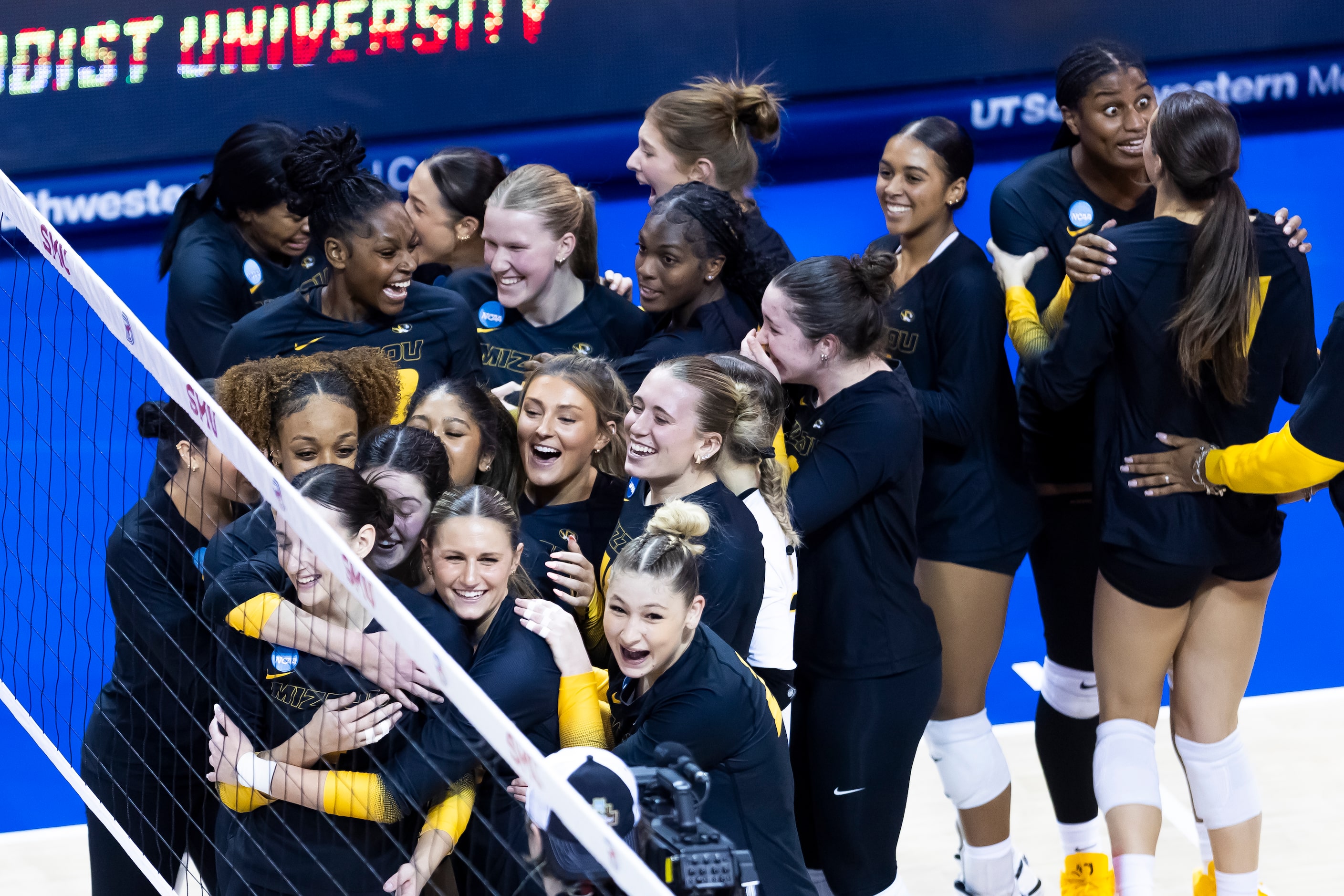 Missouri celebrates beating SMU in four sets in an NCAA college volleyball game at SMU in...