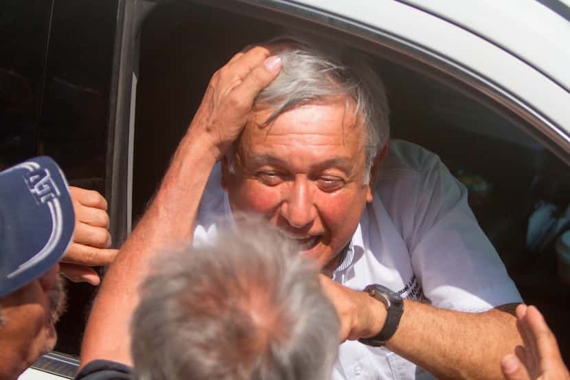 Mexico's presidential candidate for the MORENA party, Andres Manuel Lopez Obrador, greets a...