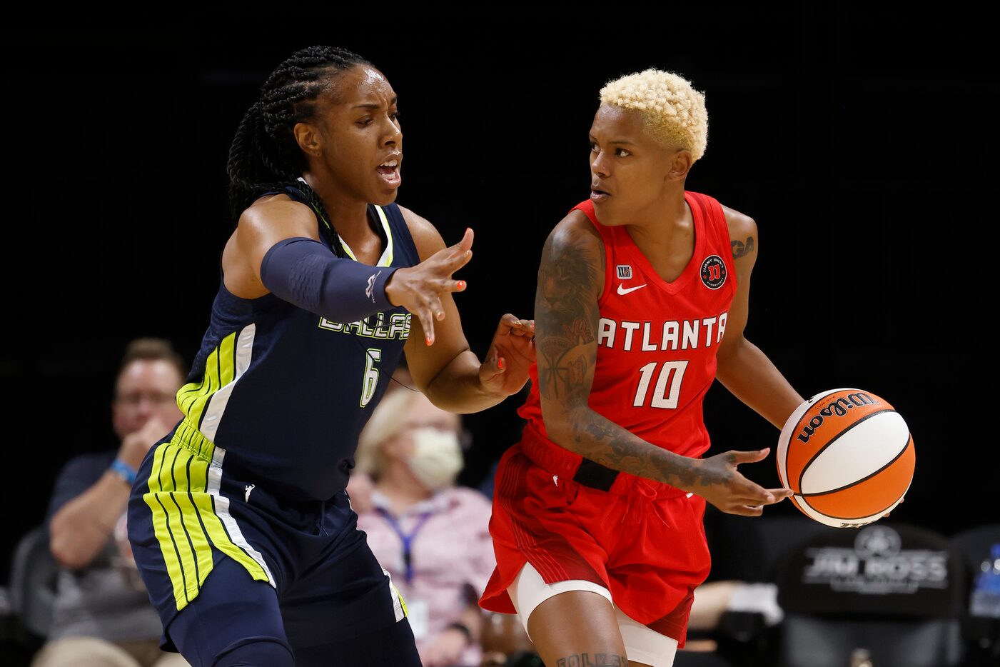 Dallas Wings forward Kayla Thornton (6) defends Atlanta Dream guard Courtney Williams (10)...