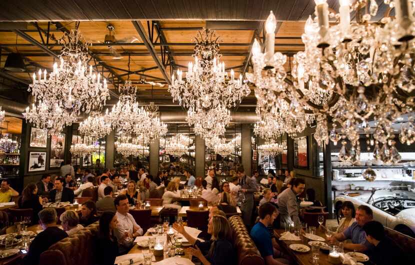 Chandeliers decorate the dining room at Town Hearth restaurant on Thursday, April 20, 2017...