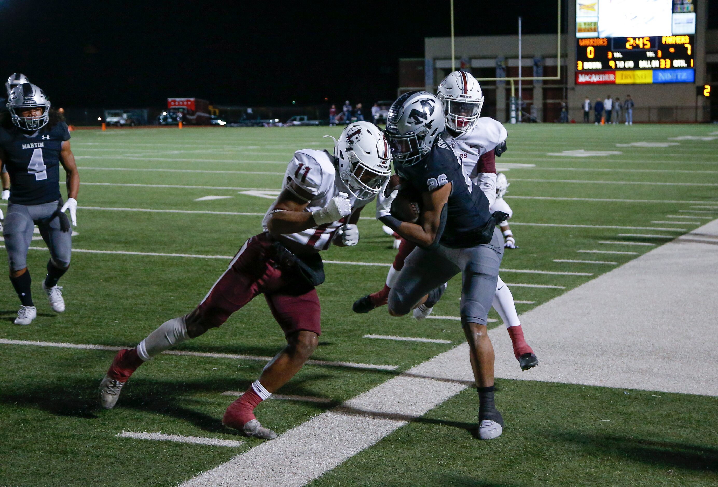 Lewisville senior defensive back Billy Sanford III (11) forces Arlington Martin junior...