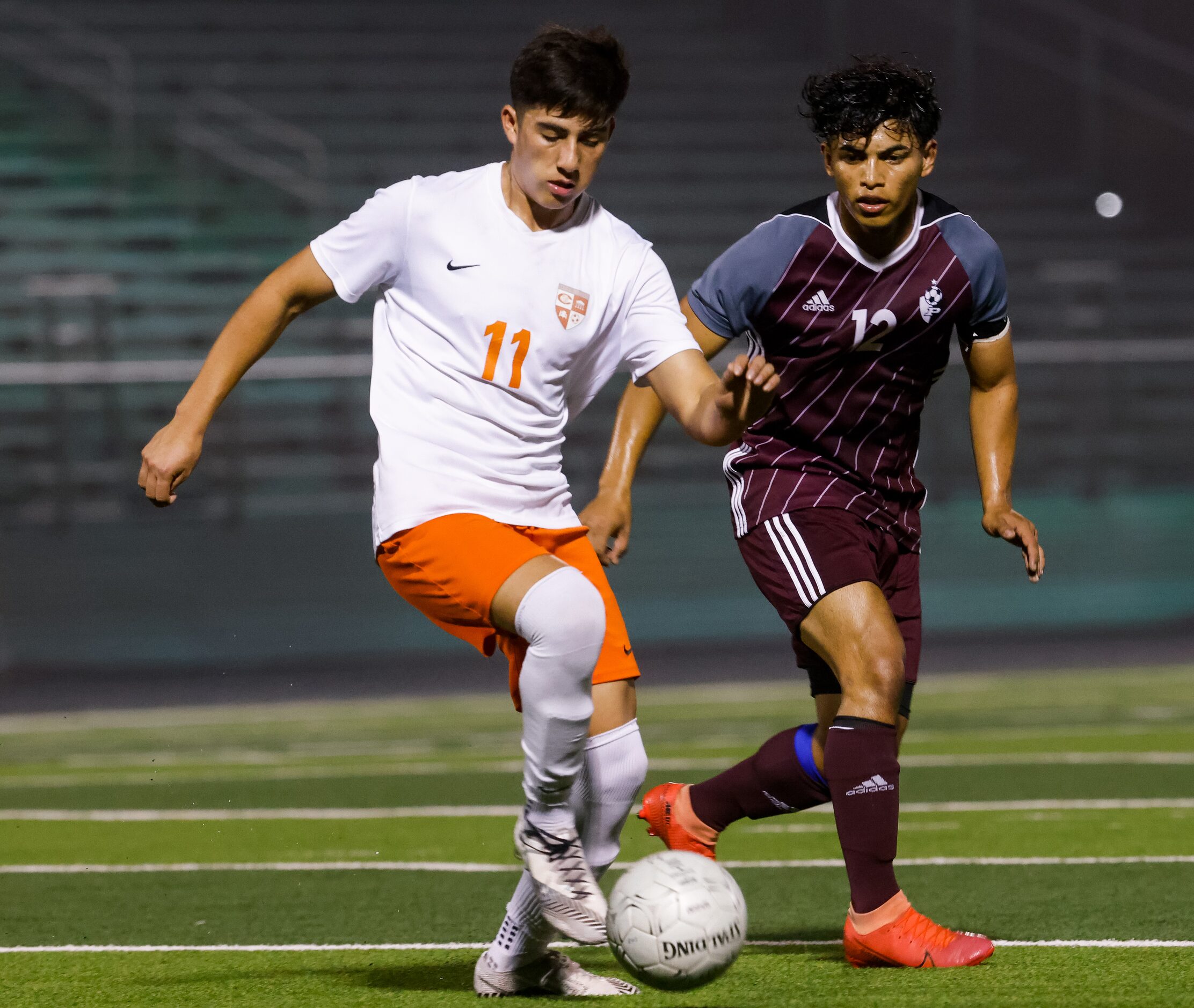 Celina's Marcos Araña (11) kicks the ball away from Palestine's Yoriel Reyes (12) during a...