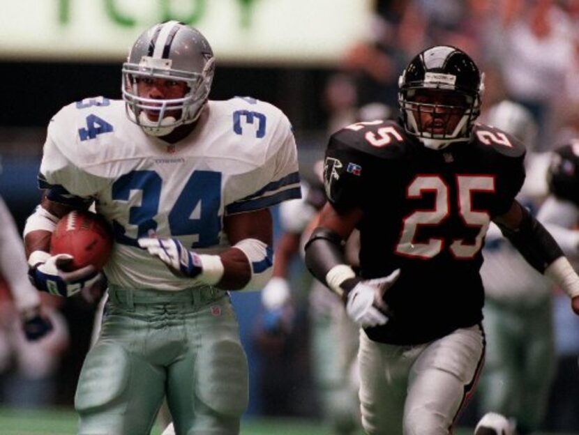 Dallas Cowboys' #34 Herschel Walker runs back the opening kickoff inside the Atlanta Falcons...