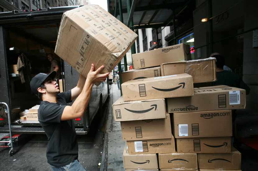 FILE - In this July 22, 2008 file photo, packages from Amazon are delivered in New York....