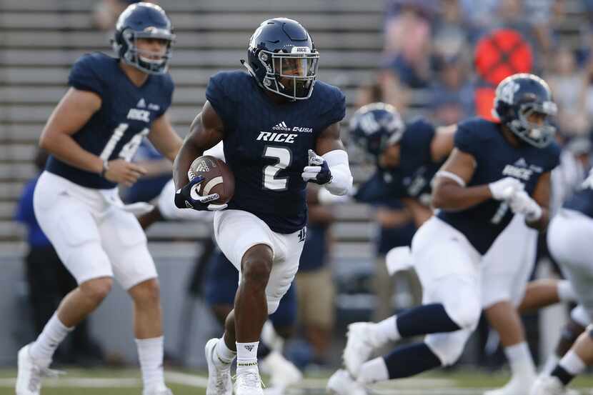HOUSTON, TX - SEPTEMBER 23:  Austin Walter #2 of the Rice Owls runs the ball in the first...