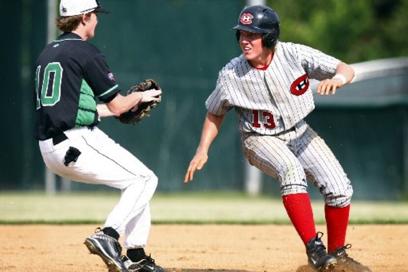 Southlake second baseman John Weiss (10 - left) tags out Colleyville Heritages' Sammy Lett...