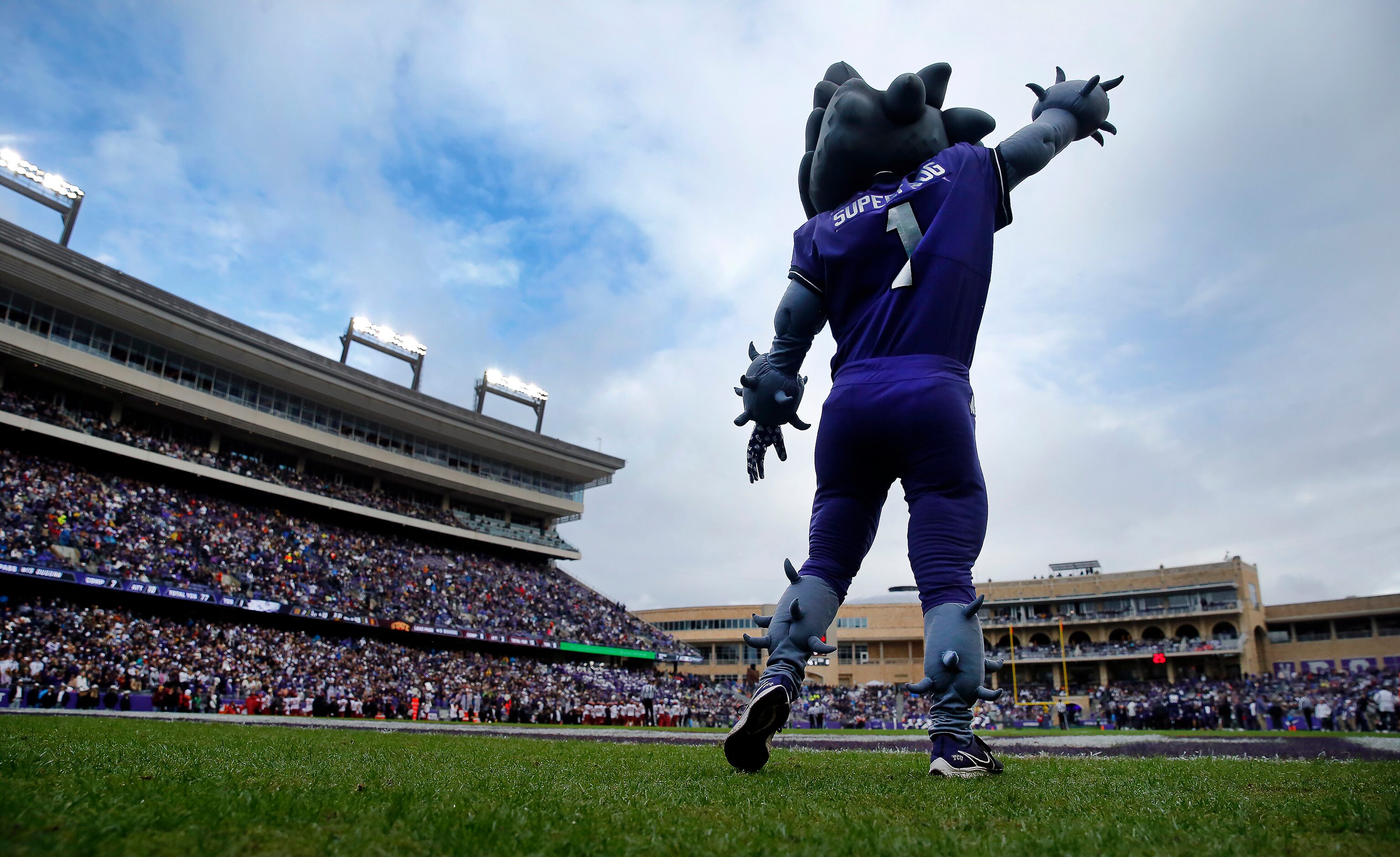 TCU Horned Frogs mascot Superfrog cheers his team as they face the Iowa State Cyclones at...