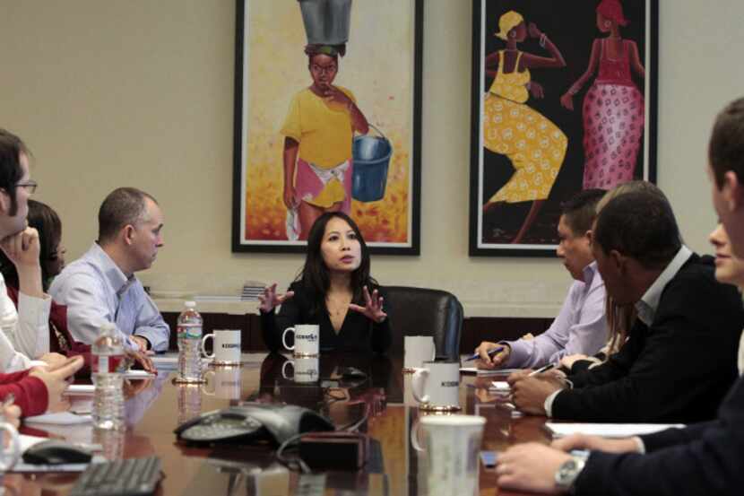 Kosmos Energy employees meet in their Dallas office.