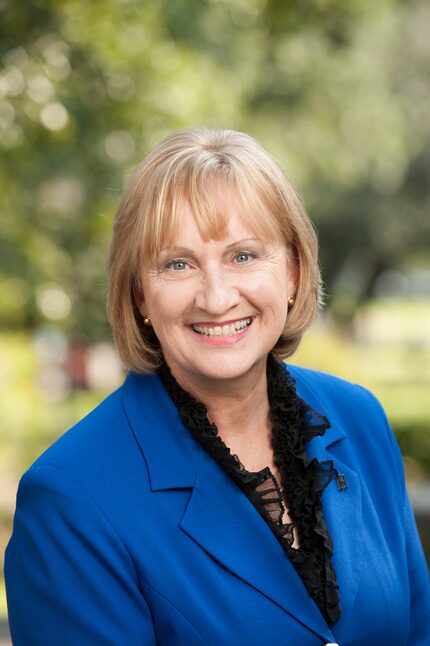 Dr. Rita Kirk poses in a blue blazer.