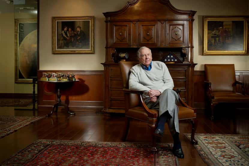 T. Boone Pickens was photographed in front of two paintings by John George Brown that will...