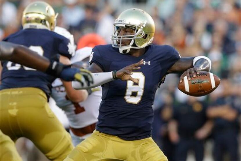 FILE - In this Sept. 5, 2015, file photo, Notre Dame quarterback Malik Zaire looks to a pass...