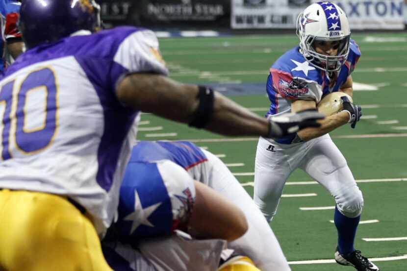 Texas Revolution's Jennifer Welter (47) runs up the field as Crunch defense closes in on her...