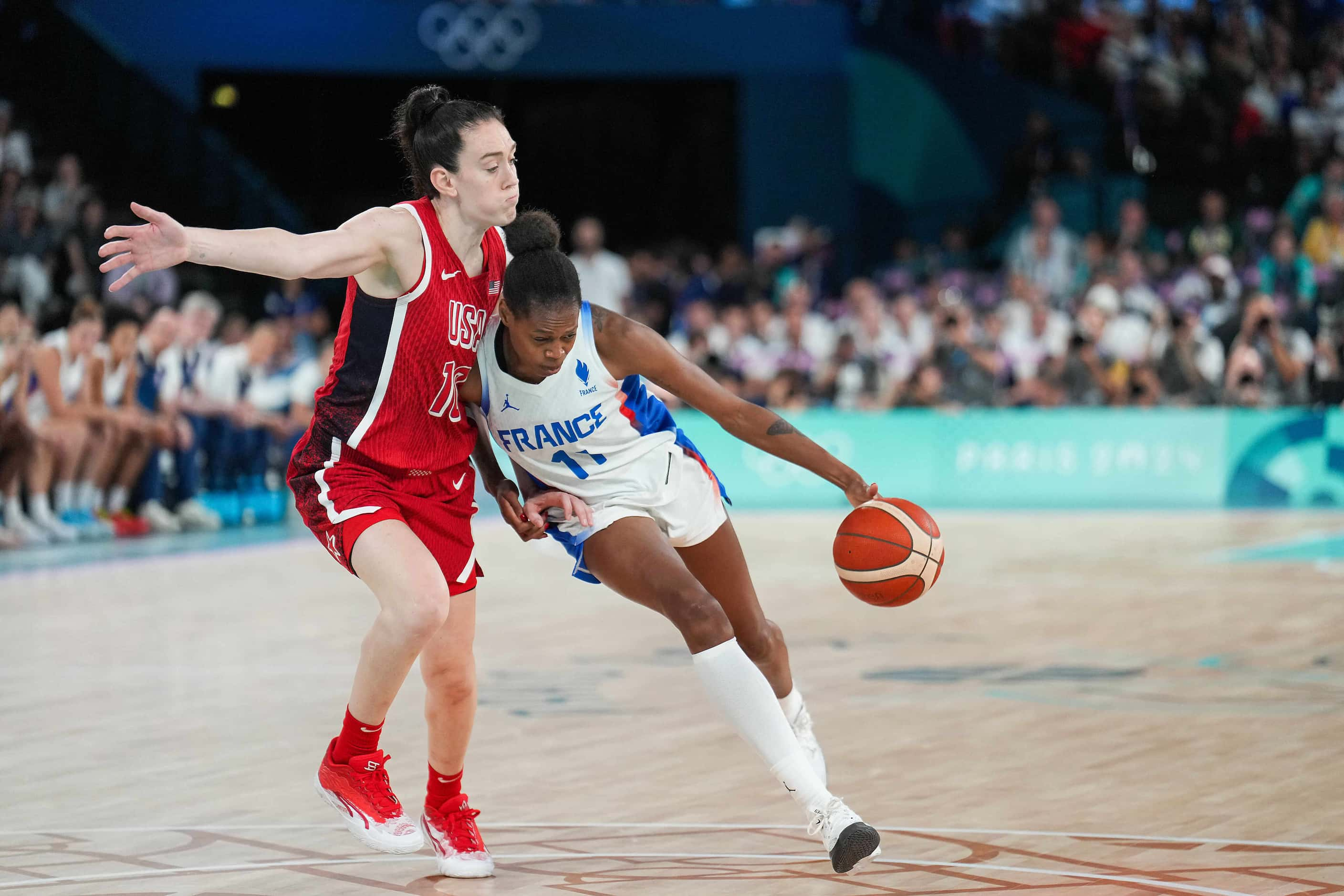 Breanna Stewart (10) of the United States defends against Valeriane Ayayi (11) of France...