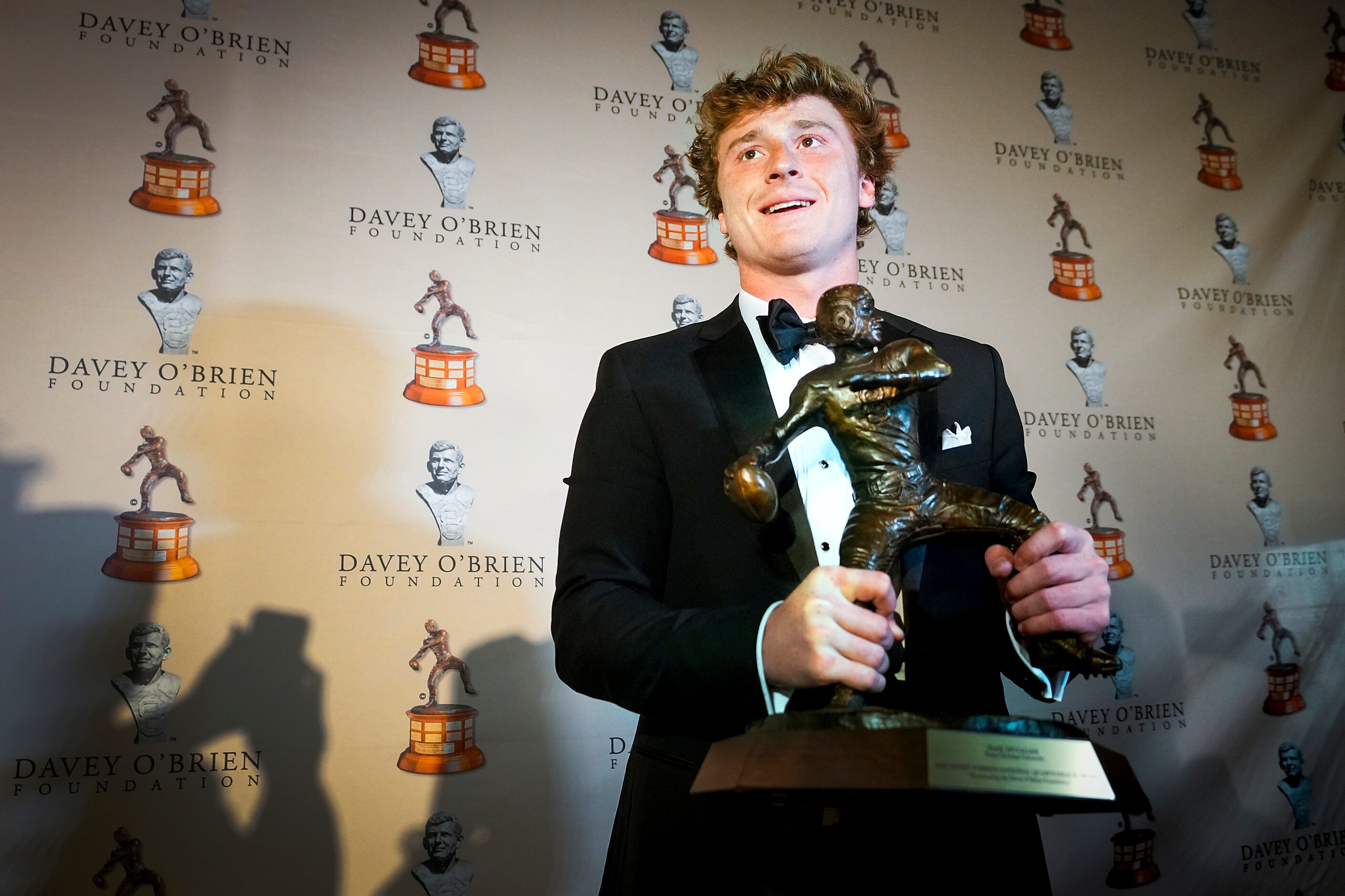 TCU quarterback Max Duggan holds the Davey O'Brien Award, given to College Football’s best...