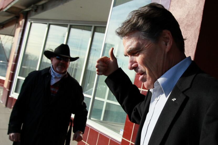 Rick Perry gave a supporter a thumbs-up outside a coffee shop in Creston, Iowa, on Tuesday.