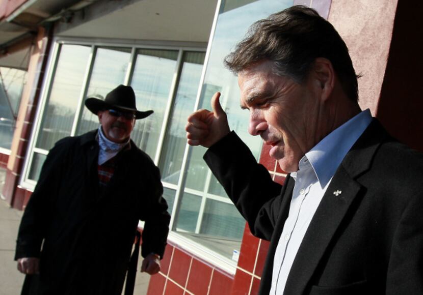 Rick Perry gave a supporter a thumbs-up outside a coffee shop in Creston, Iowa, on Tuesday.