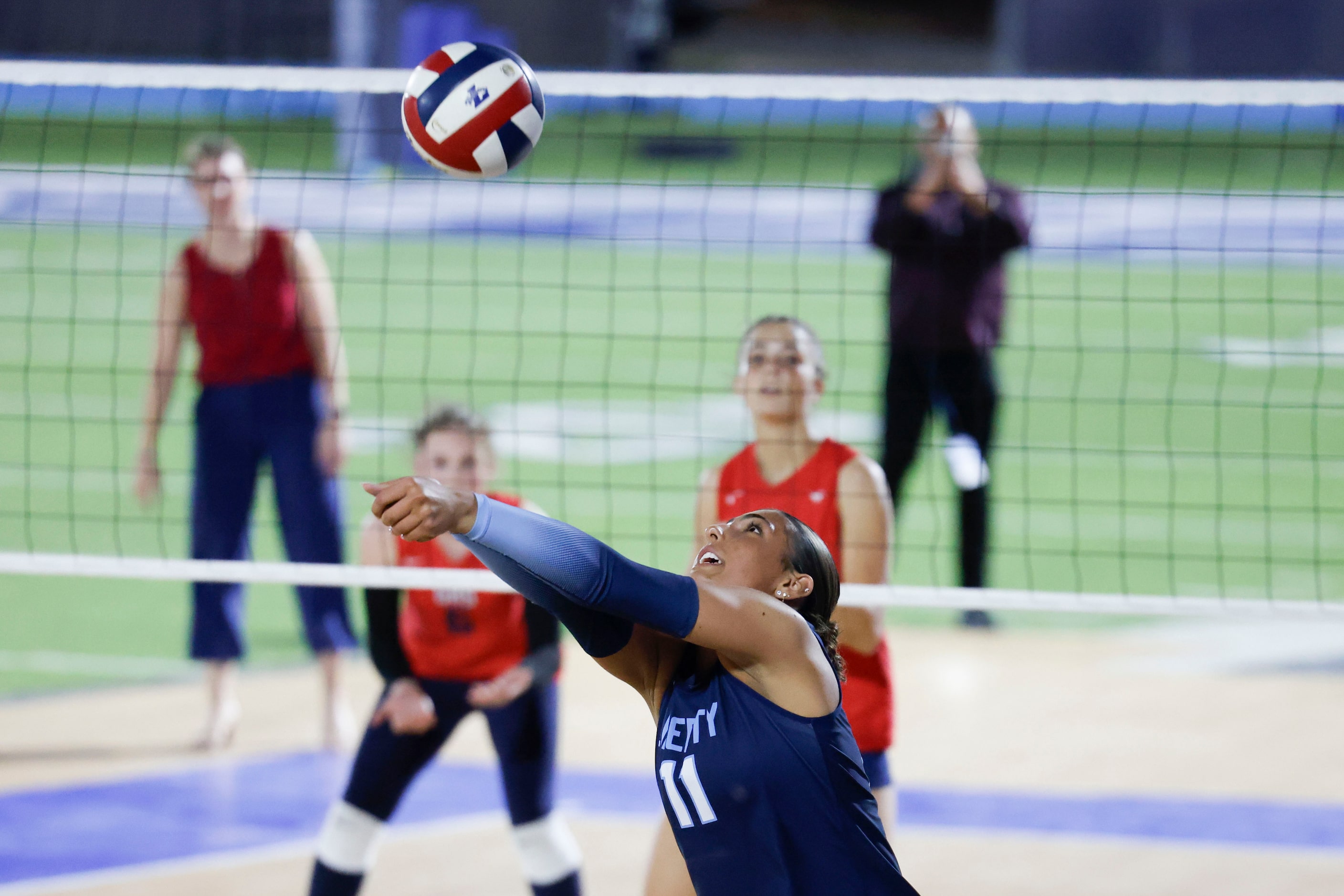 Liberty Christian School’s Naya Sal-feet-e returns the ball during the first set of a...