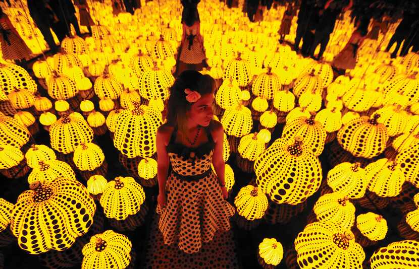 Lyza Hernandez stands amid Yayoi Kusama's installation "All the Eternal Love I Have for the...