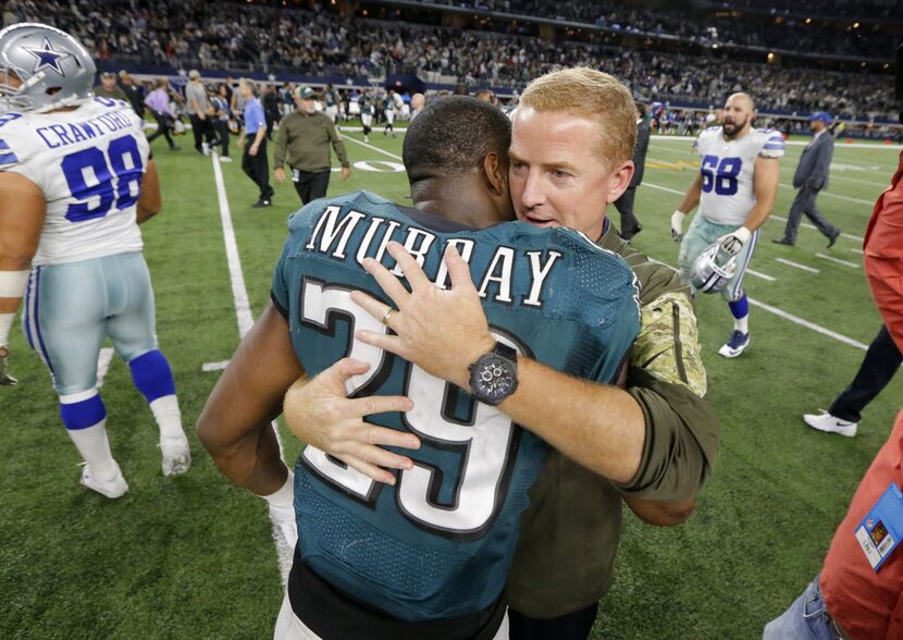 Philadelphia Eagles' DeMarco Murray (29) is hugged by Dallas Cowboys head coach Jason...