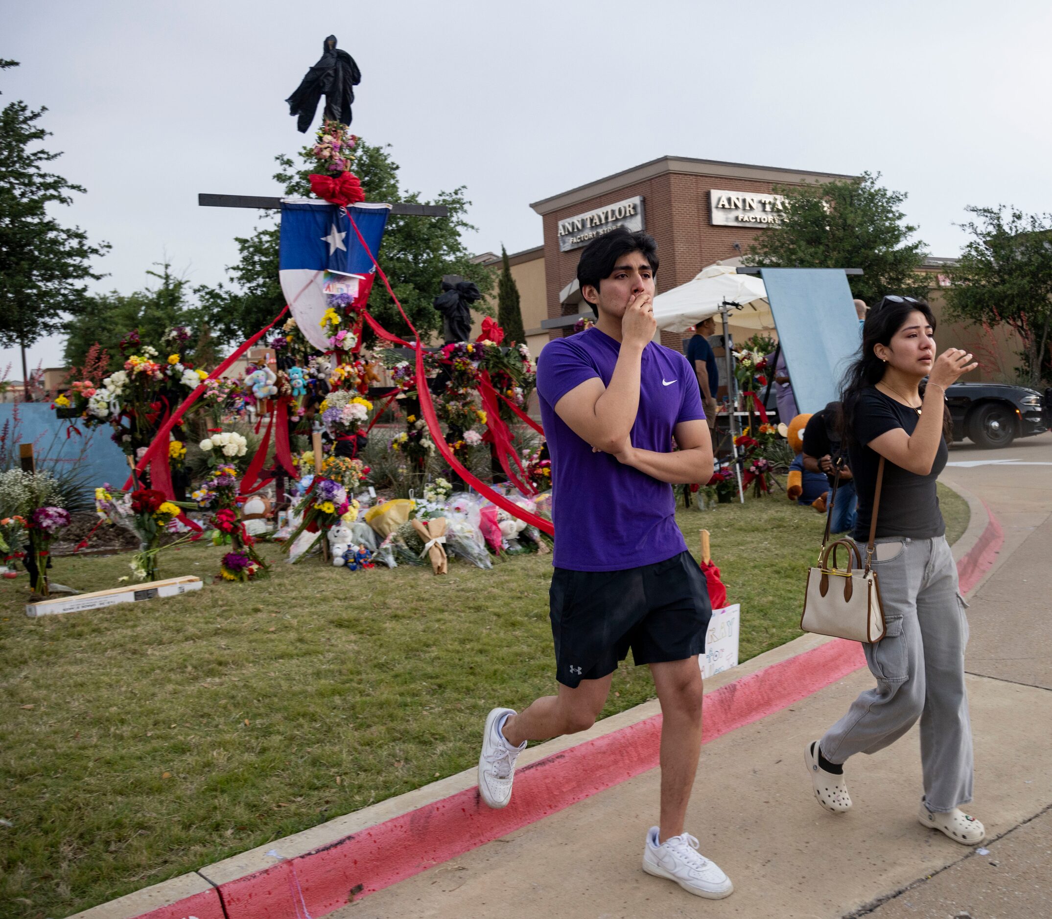 David Ramirez and sister Citaly Ramirez, who witnessed the shooting, cry after paying their...