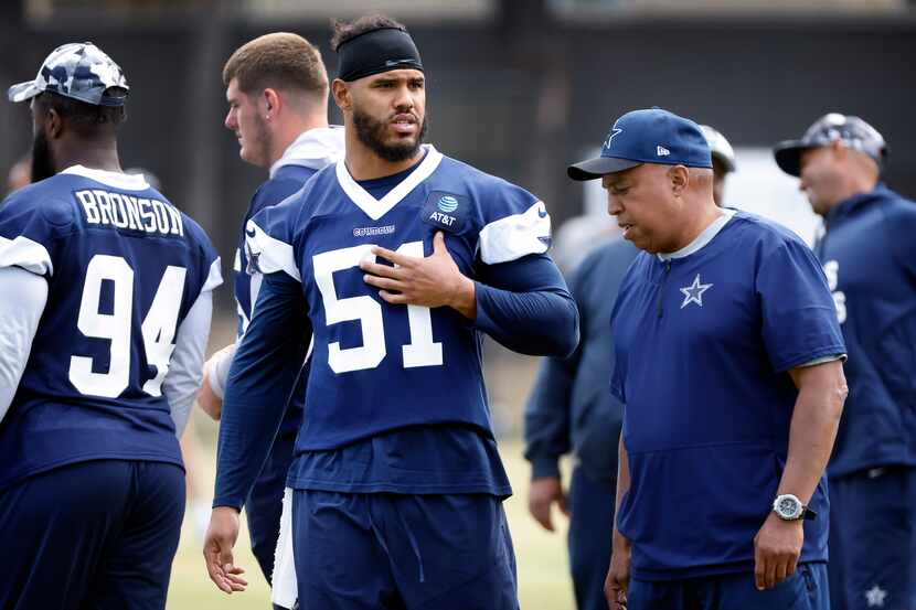 New Dallas Cowboys linebacker Anthony Barr (51) visits with his old coach, Cowboys senior...