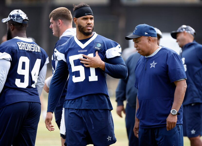 New Dallas Cowboys linebacker Anthony Barr (51) visits with his old coach, Cowboys senior...