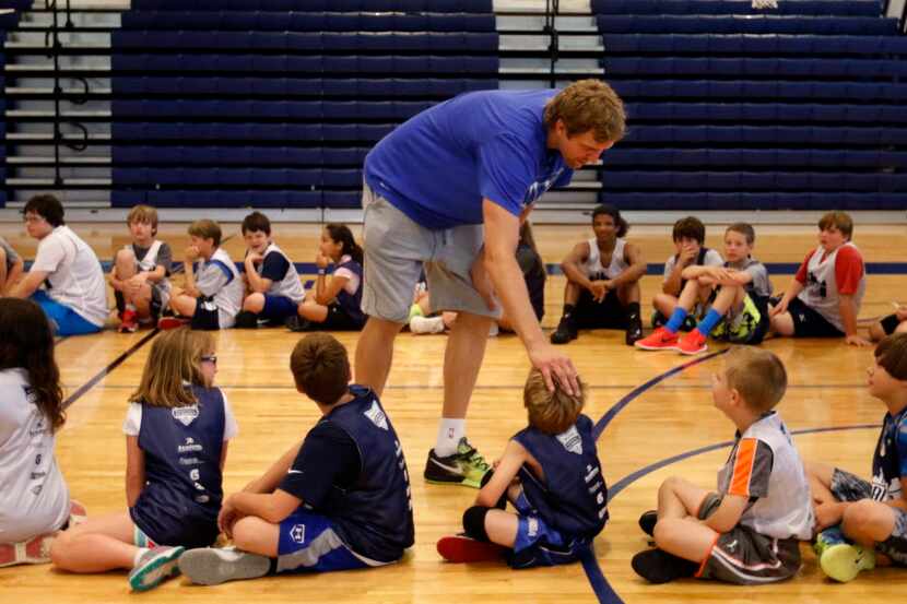 Dallas Mavericks' Dirk Nowitzki says goodbye to kids at the Mavs Basketball Academy Hoop...