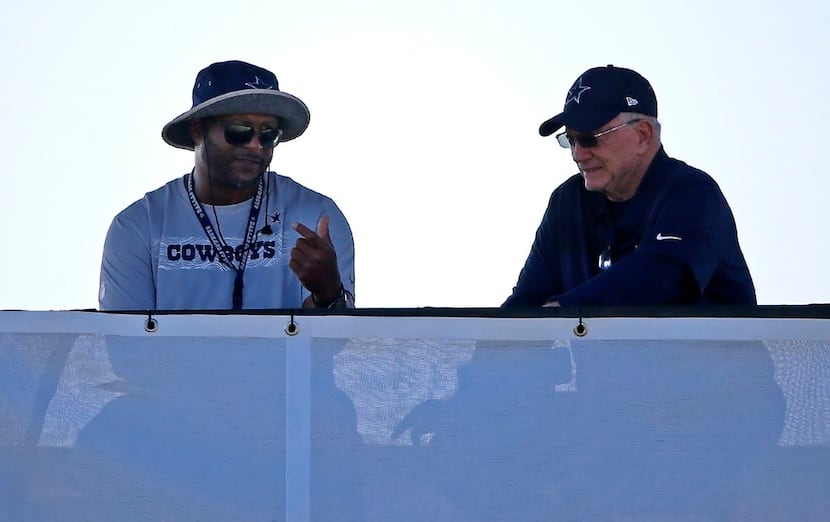 Dallas Cowboys owner Jerry Jones, right, talks with Dallas Cowboys vice president for player...