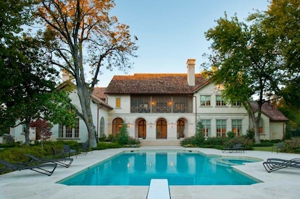 The home's backyard is built for entertainment, with a pool, tennis court and four-car garage.