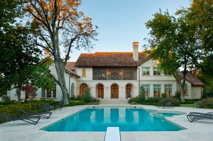 The home's backyard is built for entertainment, with a pool, tennis court and four-car garage.