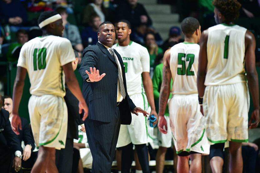 North Texas head coach Tony Benford talks to his players after an altercation with players...