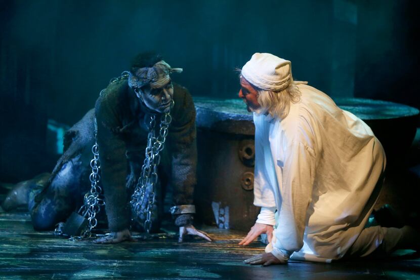 Brad Leland as Ebenezer Scrooge (right) and Will Power as Jacob Marley perform during a...