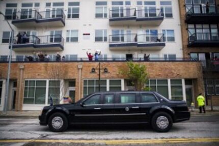  People cheered from apartment balconies as President Barack Obama passed in a presidential...