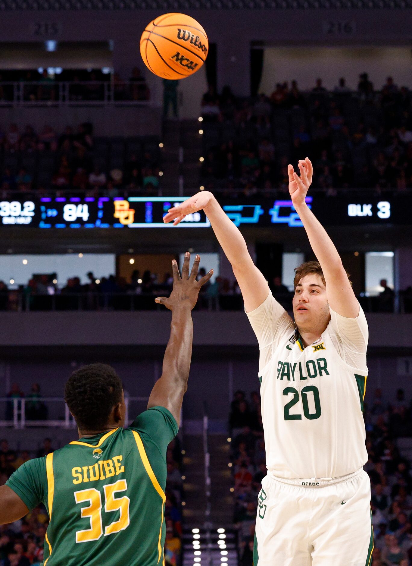 Baylor Bears forward Austin Sacks (20) shoots over Norfolk State Spartans guard Yoro Sidibe...