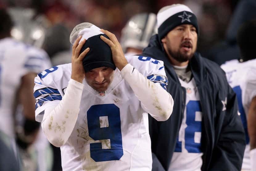 Tony Romo reacted on the sideline Sunday after his third interception killed a...
